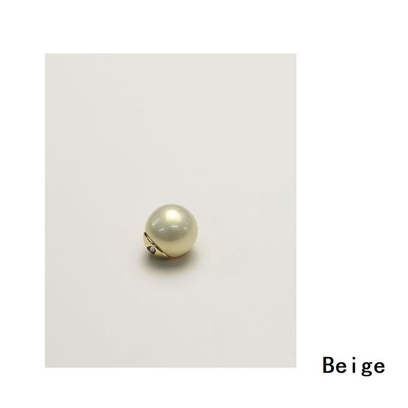 Beige glossy pearl shirt button with gold-tone metal base and loop hole