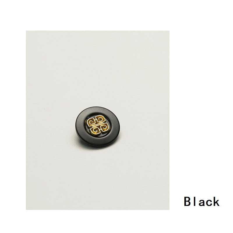 Black Chinese-style metal clothing button with gold filigree knot design, round face