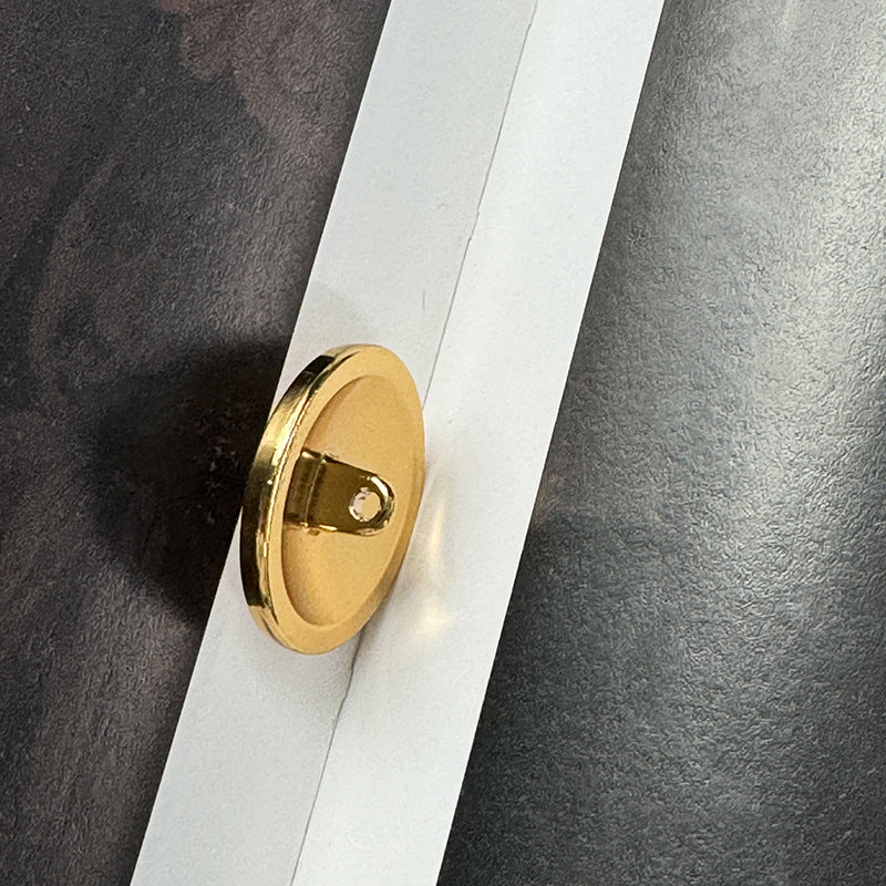 Gold alloy base button with metal loop shank and flat back
