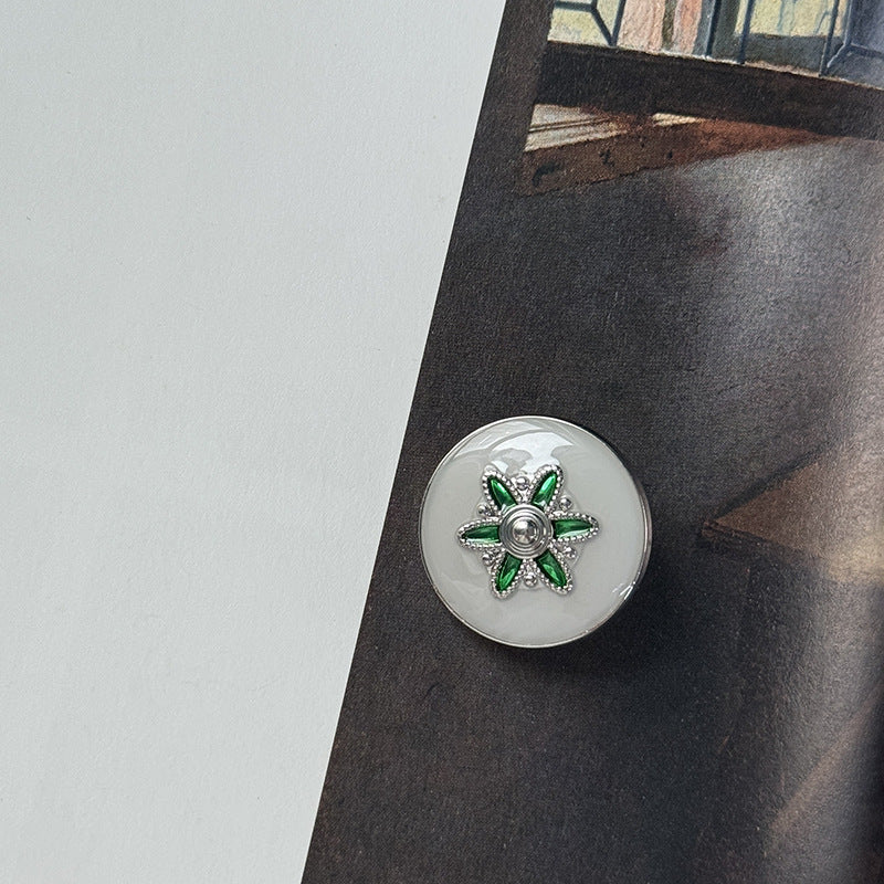 Silver alloy button with green flower star motif and metal loop shank