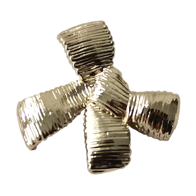 Gold striped bow metal button close-up with ridged bands