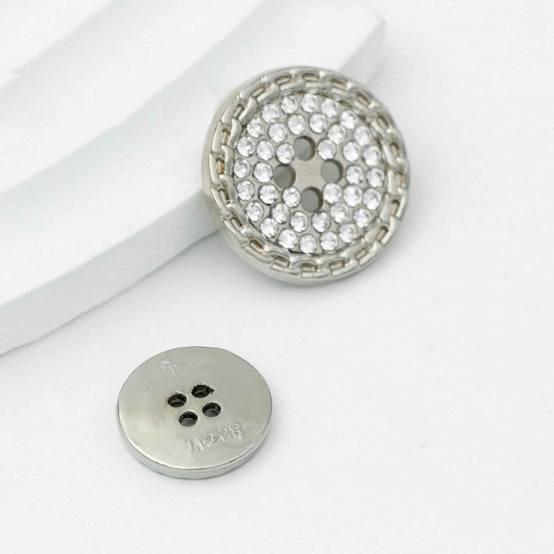 Silver rhinestone 4-hole round button, crystal-studded front and metal back plate