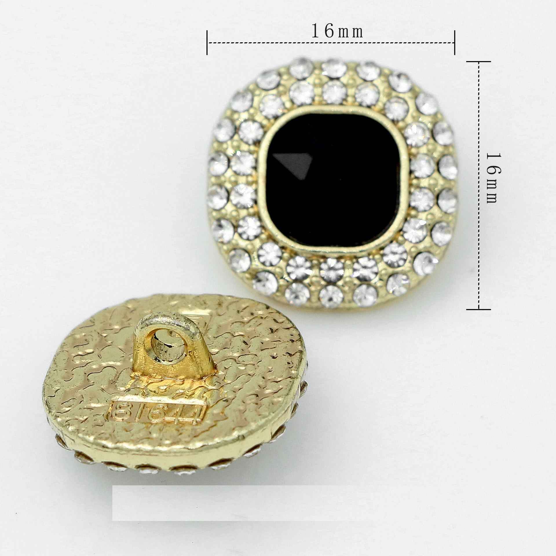 16 mm crystal rhinestone shank button, gold setting with black square center.