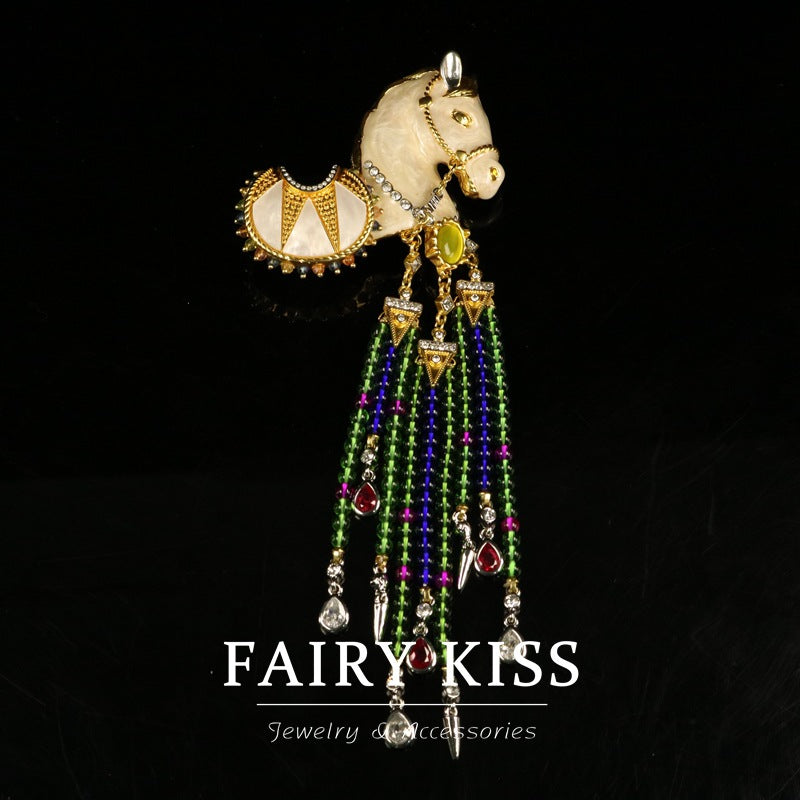 Pony enamel brooch with tassel pendant, cream face, green detail, dangling multicolor beads