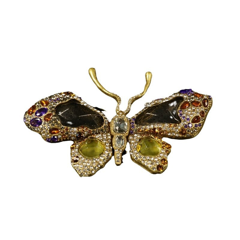 Vintage butterfly brooch, gold-tone rhinestones, purple/green gems, central dark stones