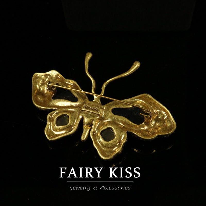 Gold-tone butterfly brooch pin and clasp, back view