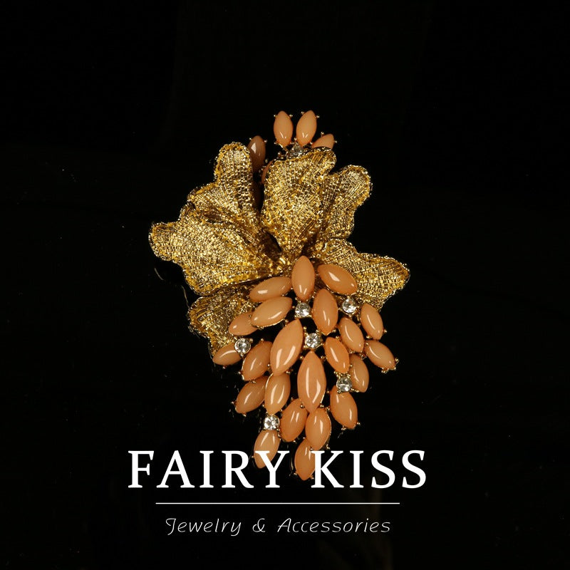 Grape brooch coat pin: goldtone leaf with orange teardrop rhinestone accents