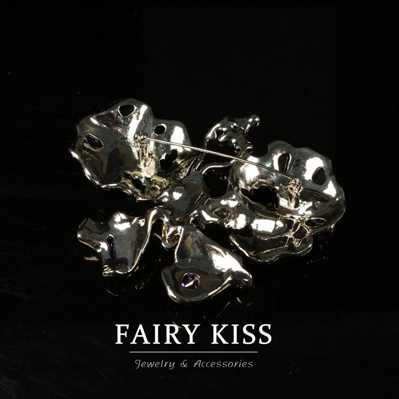Silver-tone pin back with bar clasp and rhinestone butterfly wings, purple accents