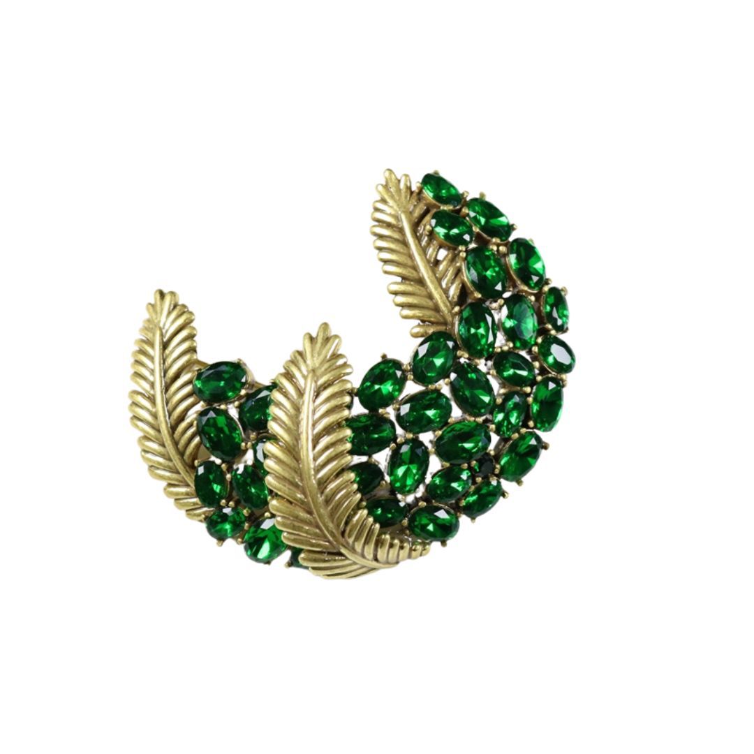 Green rhinestone diamond-encrusted feather brooch with copper leaf detail