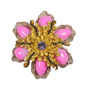Pink rhinestone floral brooch with gold electroplated setting, green accents, blue center