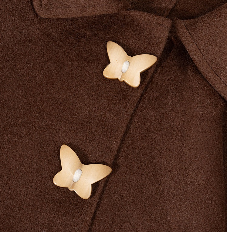 Butterfly resin buttons in khaki, two-hole design, shown on dark fabric