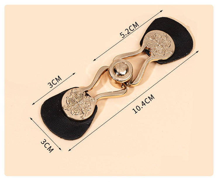 Toggle button size shown: 10.4 cm; black leather pads with gold-tone metal parts