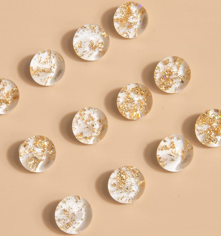 Round gold-speckled decorative button pieces