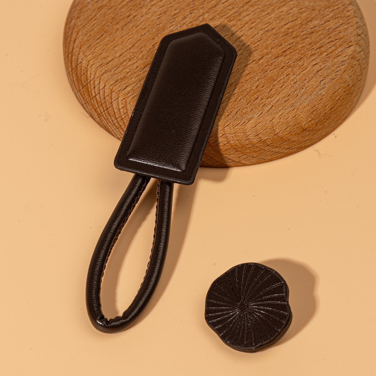 Dark leather Chinese knot button with oval plate and round textured disc
