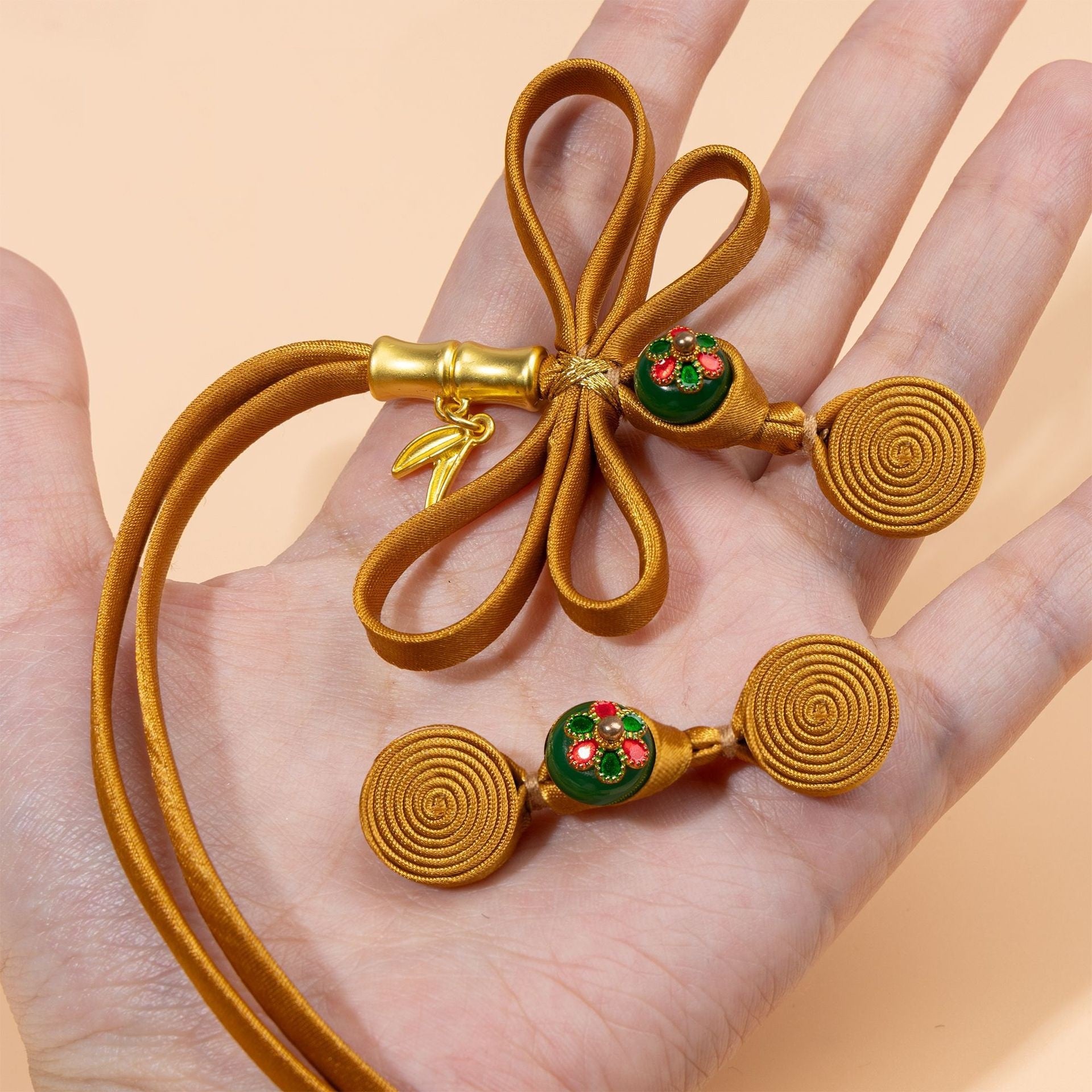 Antique gold cord bow cloth buttons with red/green enamel centers, 5 pcs