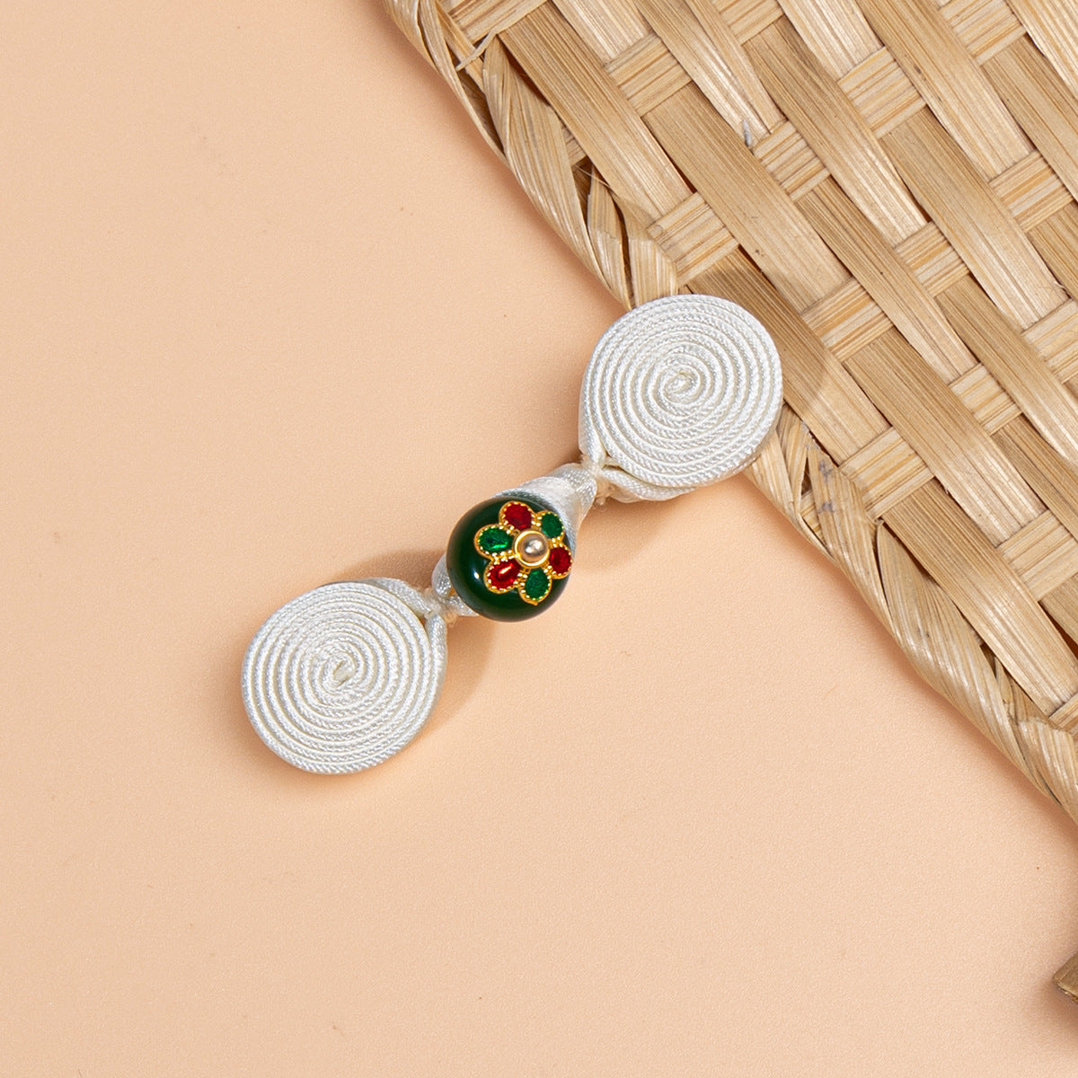 White spiral Chinese knot buttons with green enamel center, 2-piece view