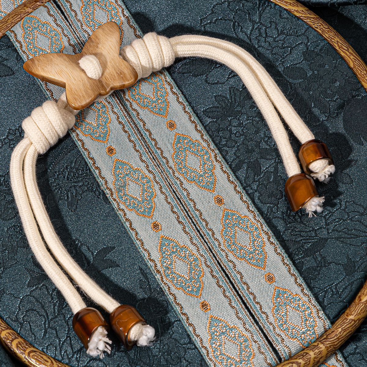 Butterfly toggle buttons for trench coats: white cord, wooden butterfly, amber resin caps