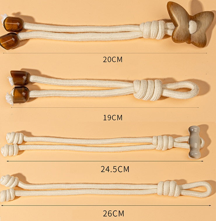 4 butterfly toggle cords with knotted white rope and amber/white resin end caps