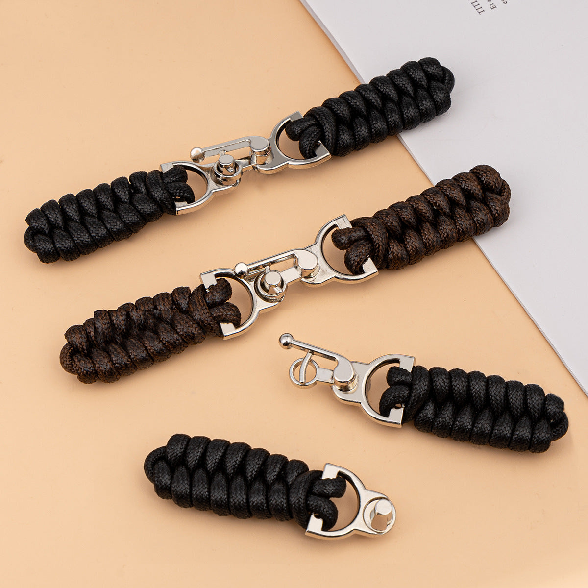 3 waxed-rope sew-on toggle buttons with metal buckles, black and dark coffee