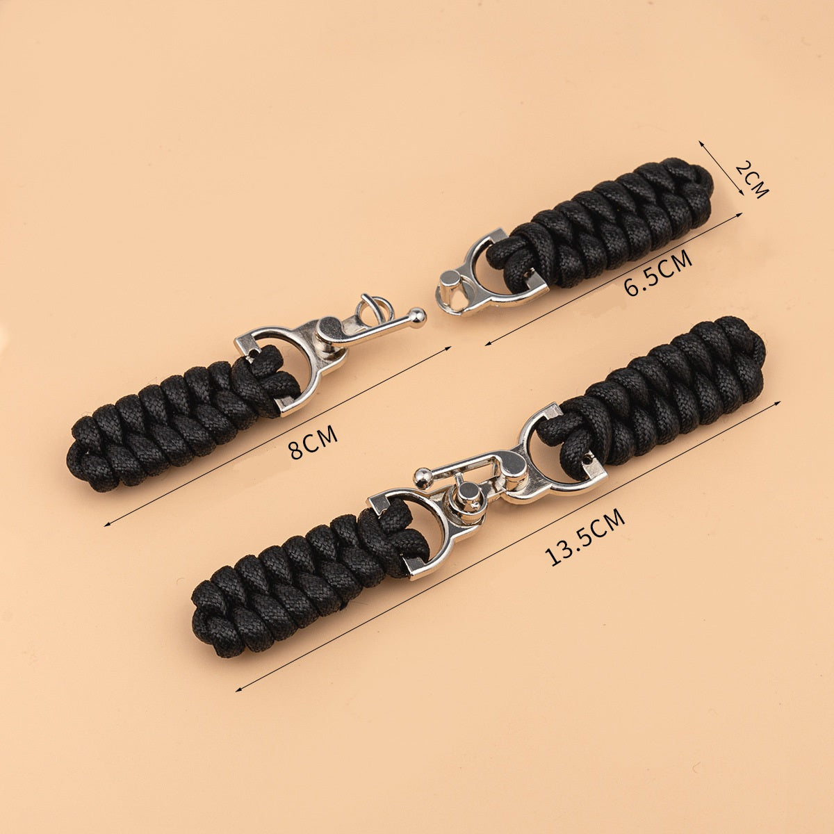 Waxed rope toggle buttons with metal buckles; lengths 13.5cm, 8cm, 6.5cm