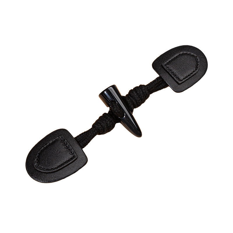 Black leather sew-on buttons with resin horn top and dark cord loop ends