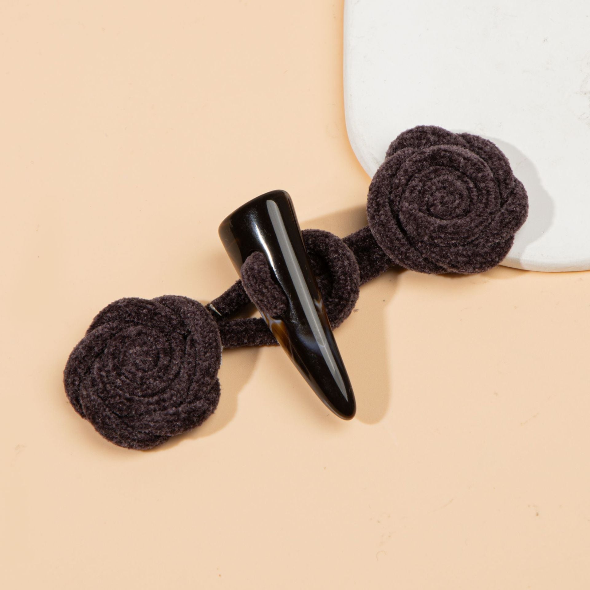 Corduroy rose sew-on toggle buttons in dark gray/black with black resin horn tips