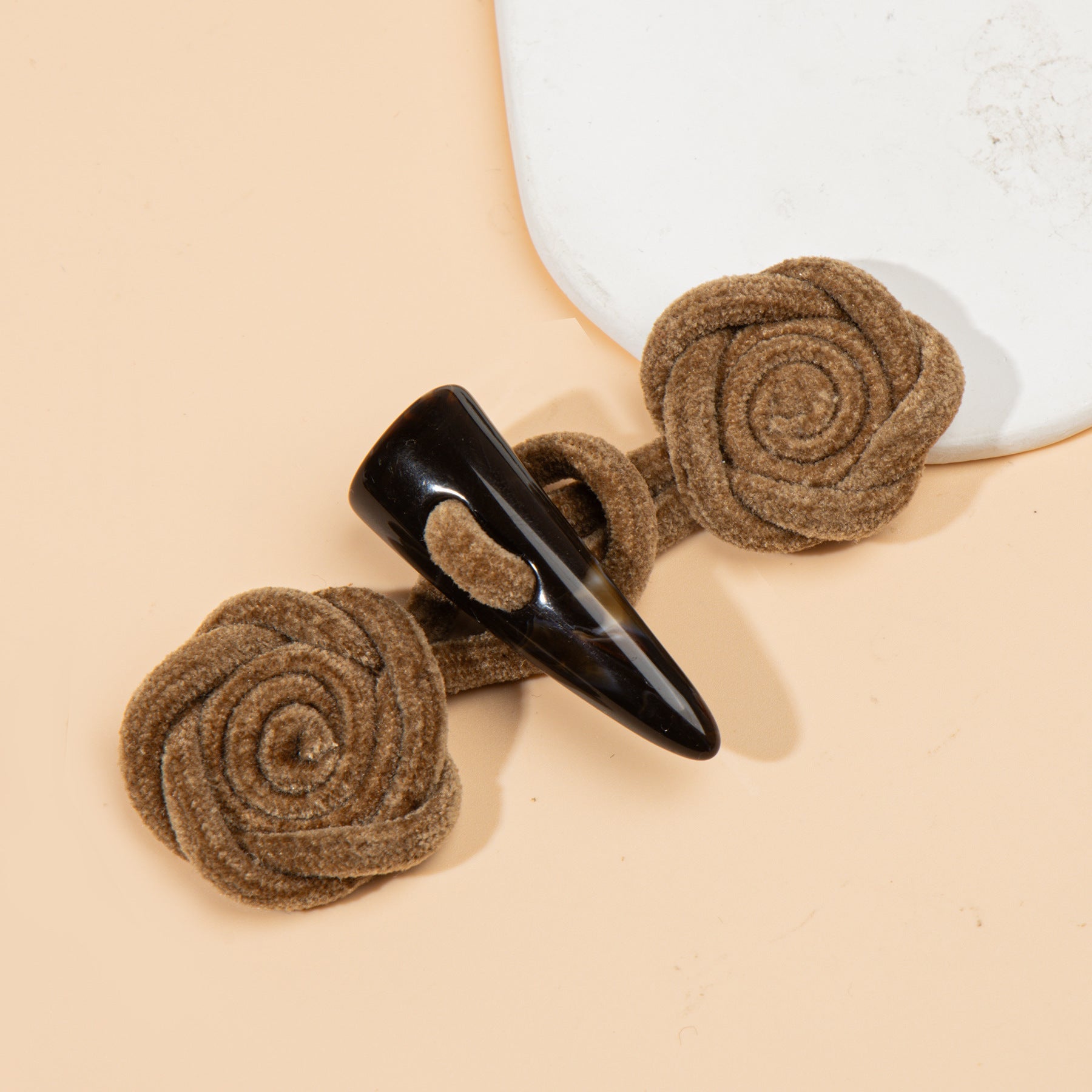 Corduroy rose sew-on toggle buttons in light brown/taupe with black resin horn tips