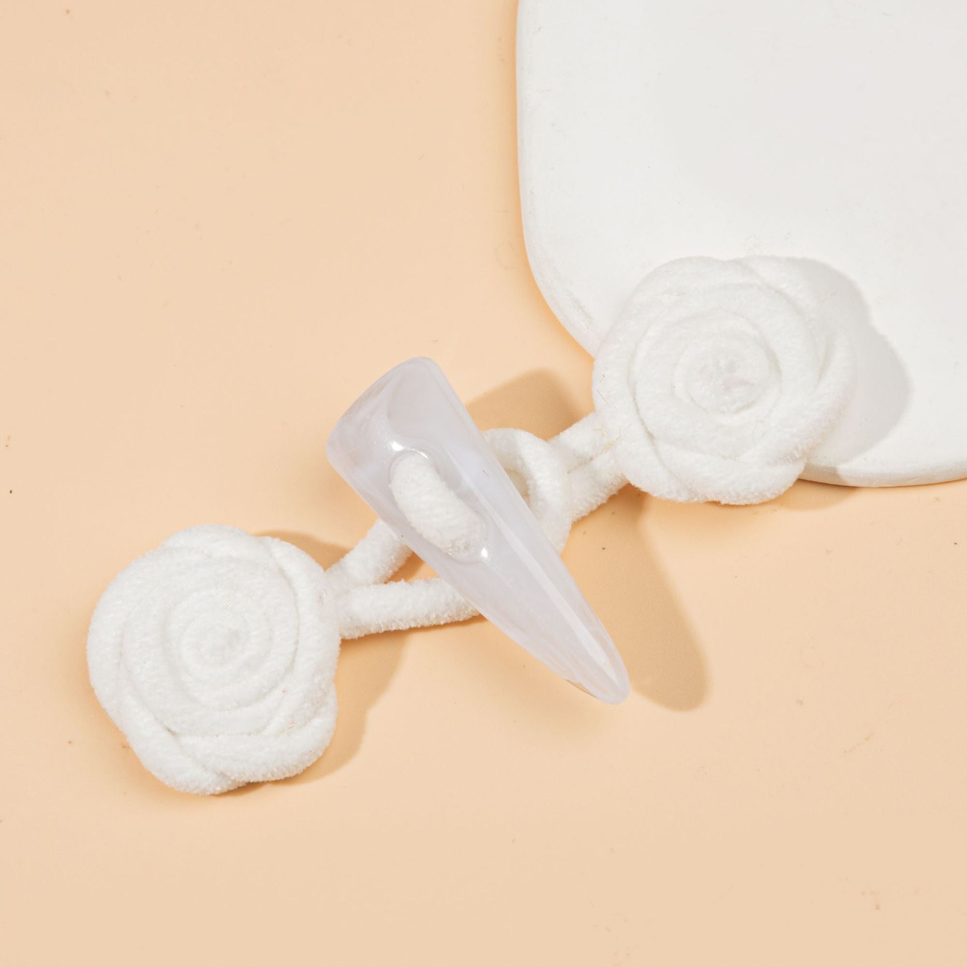 Corduroy rose sew-on toggle buttons in white with clear resin horn tips