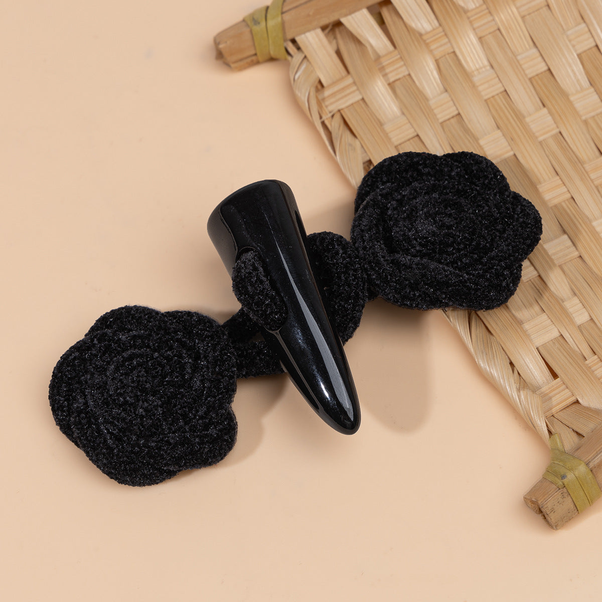 Corduroy rose sew-on toggle buttons in black with black resin horn tips