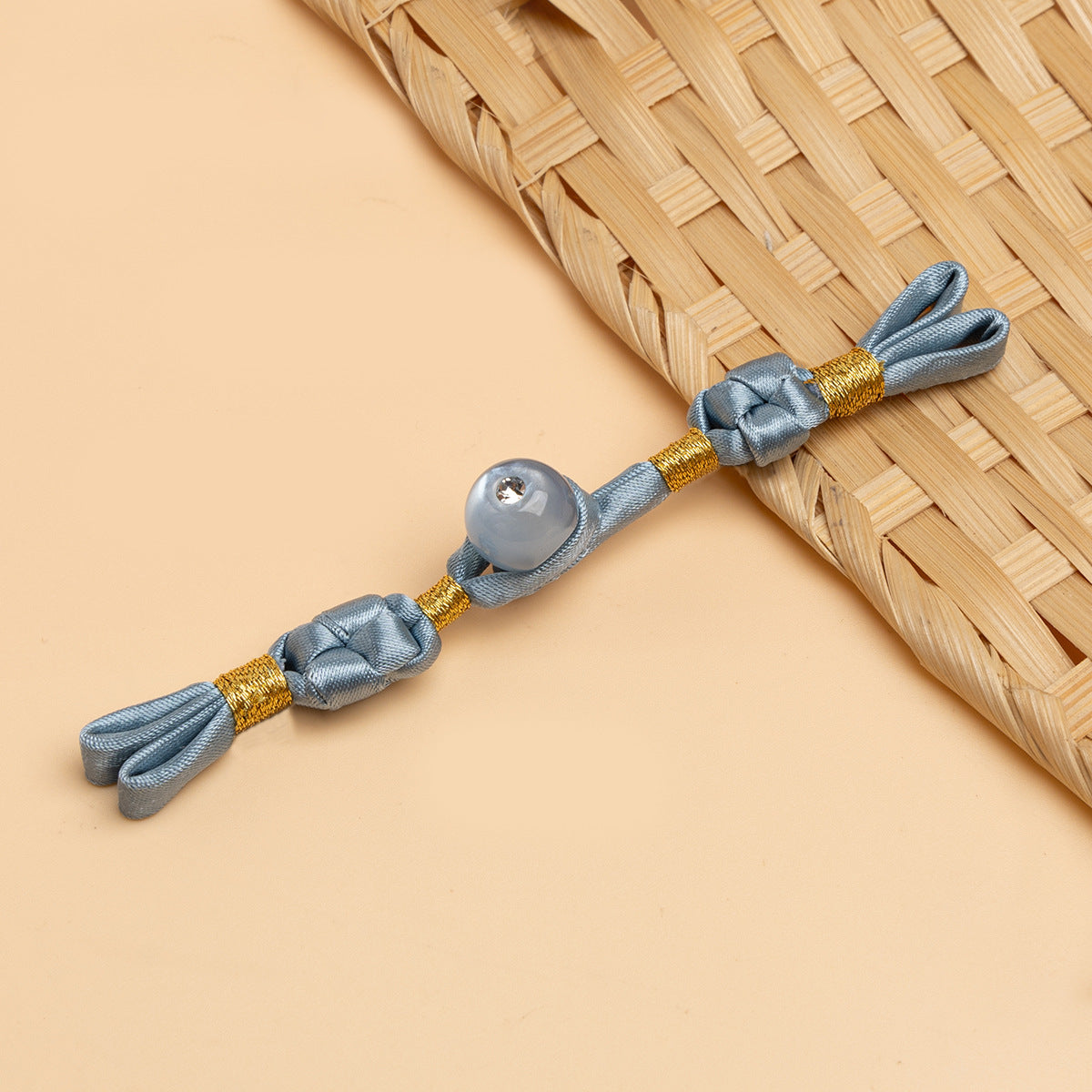 Light blue cheongsam panko with braided cords and silver round stone button