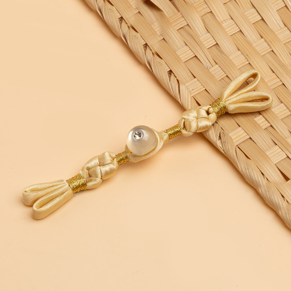 Beige cheongsam panko with braided cords and pearl-like round stone button