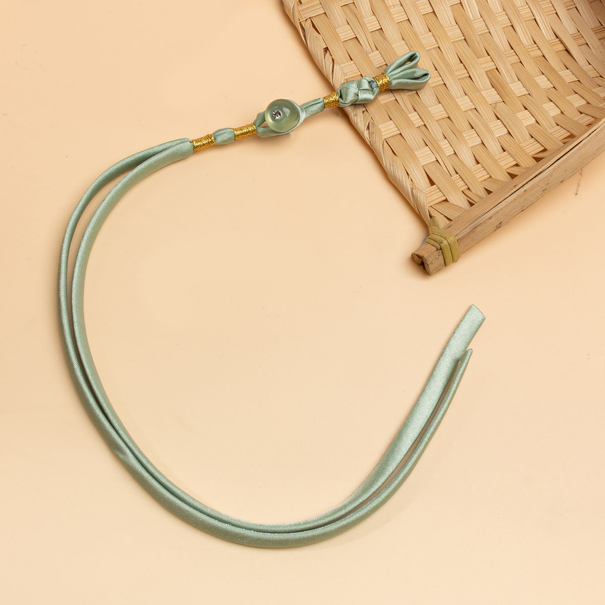 Sage green cheongsam panko cord with knot detail and green round stone button