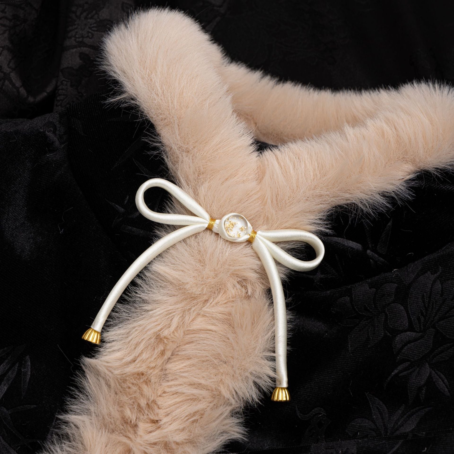 Satin bowknot button with white ribbon, gold center and tassel ends