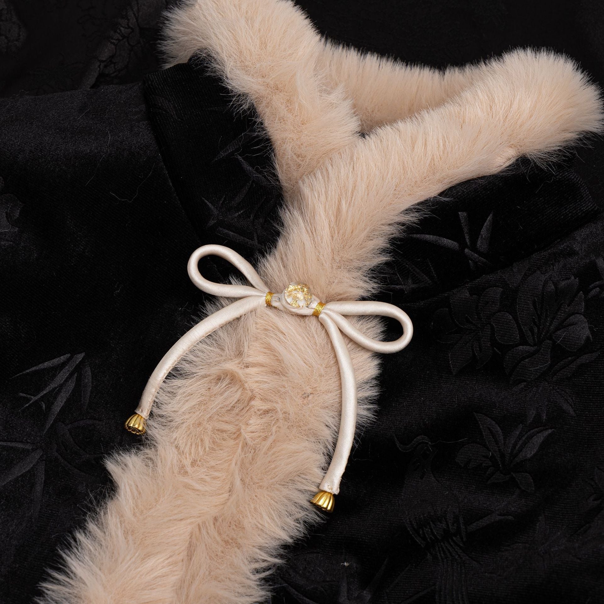 Satin bowknot button with cream ribbon, gold center and tassel ends