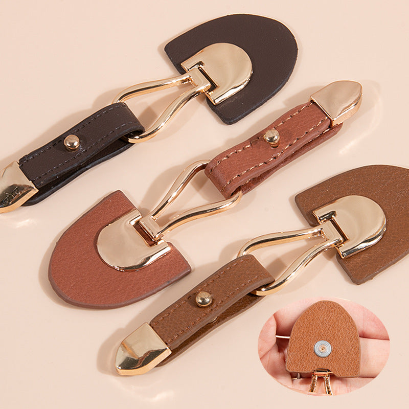 Dark brown leather sew-on toggle with gold metal buckle and rivet