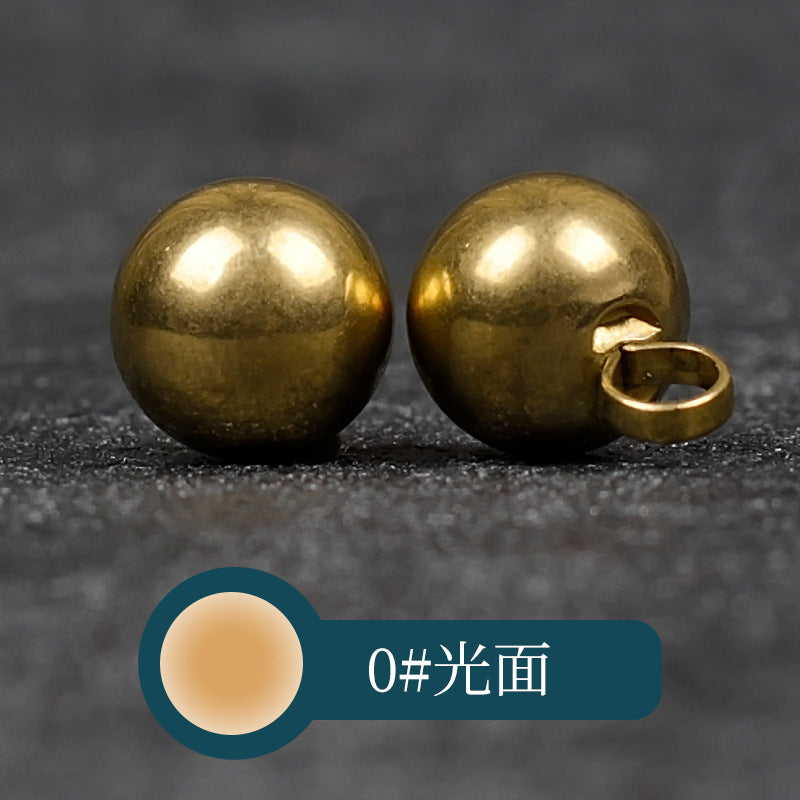 Round copper metal button with smooth front and looped shank back