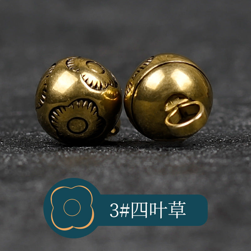 Copper metal buttons with textured petal motif front and looped shank back