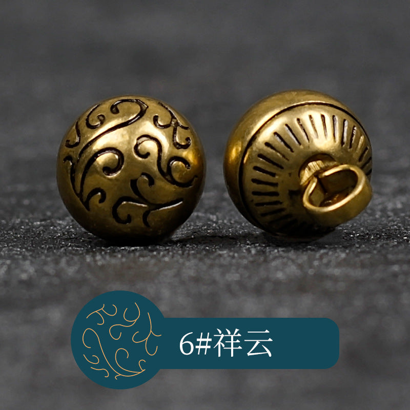 Copper swirl-motif button front and ridged half-moon back with looped shank