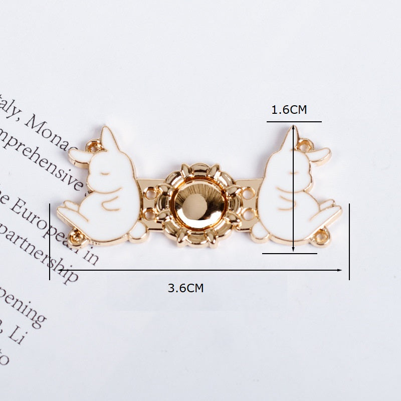 Rabbit button pair with round filigree center, 3.6cm x 1.6cm size indication