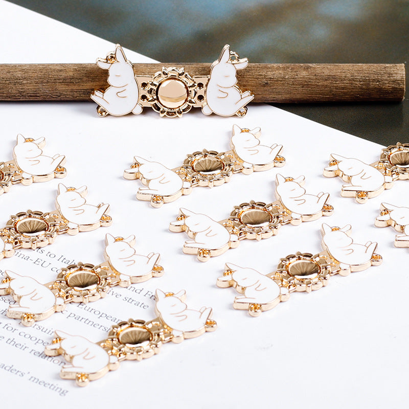 Set of 12 light gold metal rabbit buttons with round centers, white enamel rabbits
