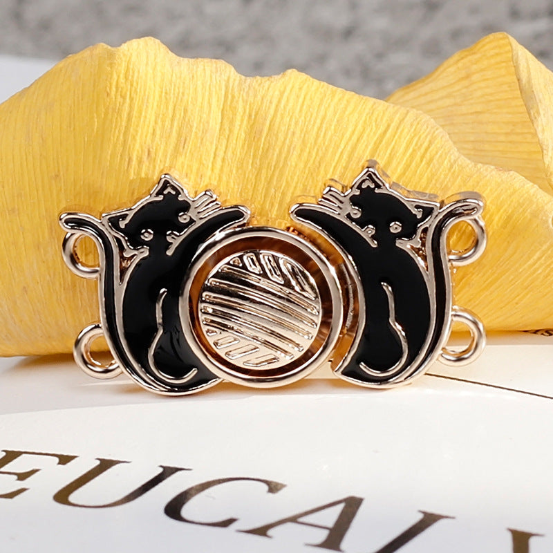 Black cat vintage hanfu metal button pair, ridged center disc and gold-tone 4 loops