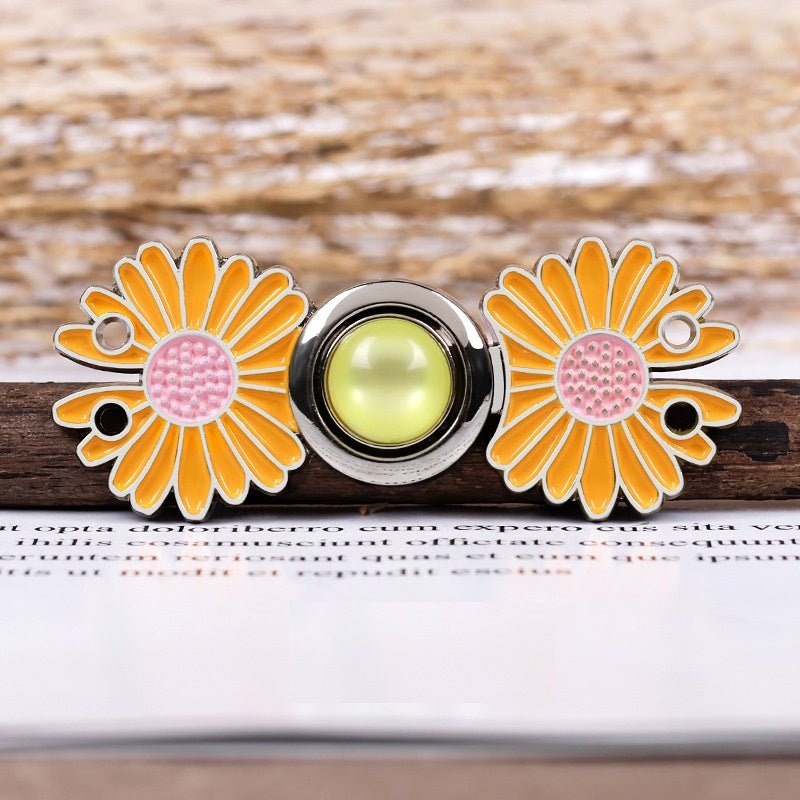 Daisy metal pair buttons, yellow/orange petals with pink centers and round snap ring, 4.7cm