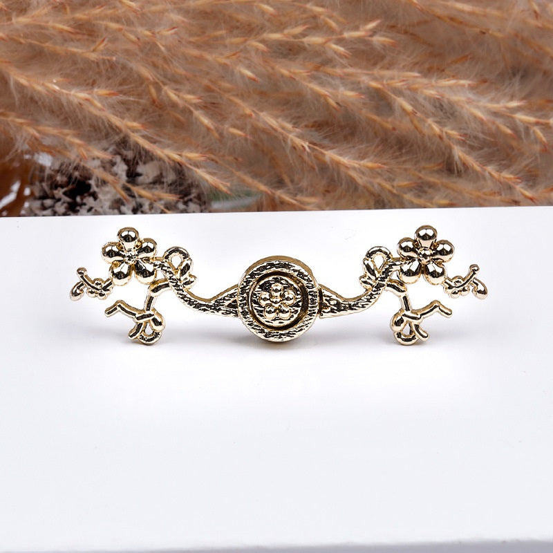 5cm metal frog button, gold-toned finish with embossed plum blossom medallion and knots