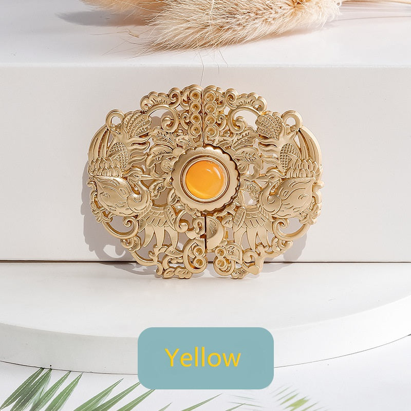 Golden auspicious phoenix hook button with yellow center cabochon and carved filigree
