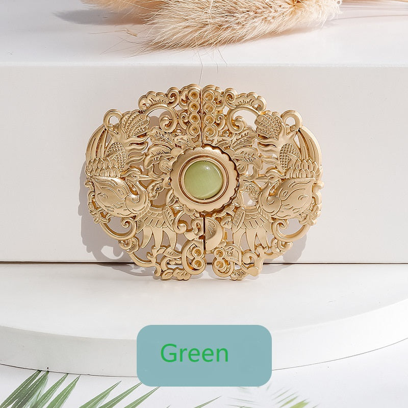 Golden phoenix hook button with green center cabochon, detailed decorative filigree