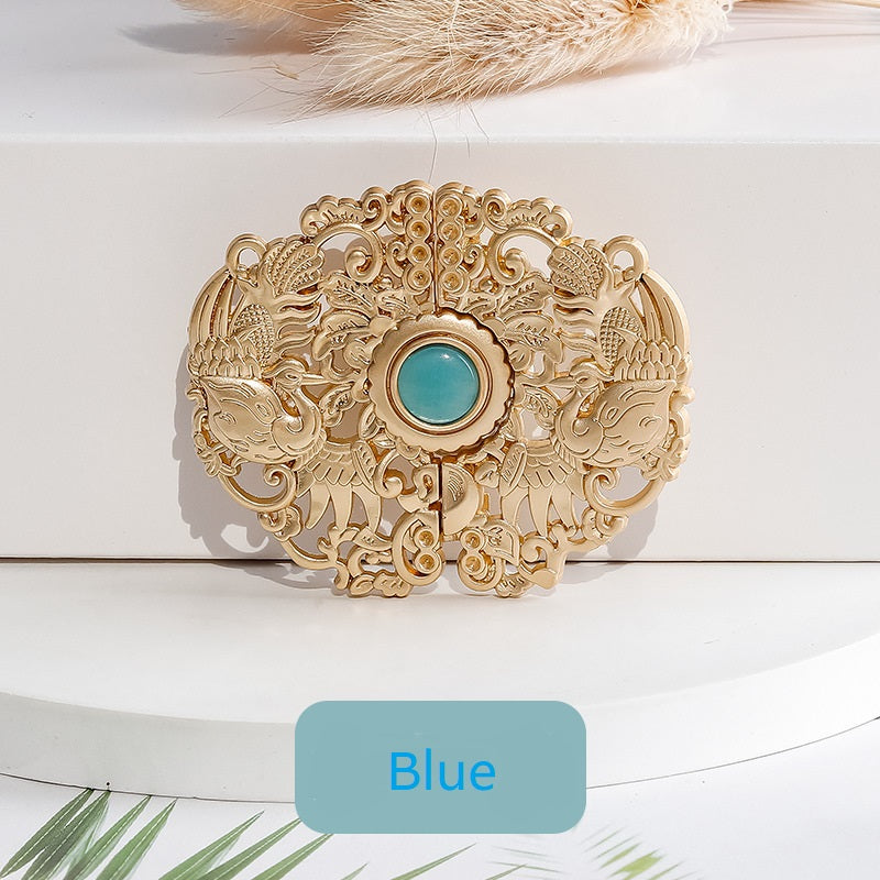 Golden phoenix hook button with blue center cabochon, ornate carved filigree frame