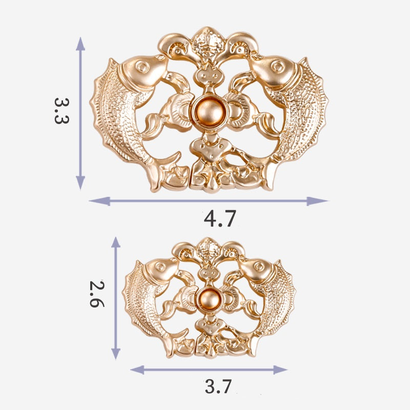 Gold-tone Chinese frog button with koi carp motif; approx 4.7 cm wide