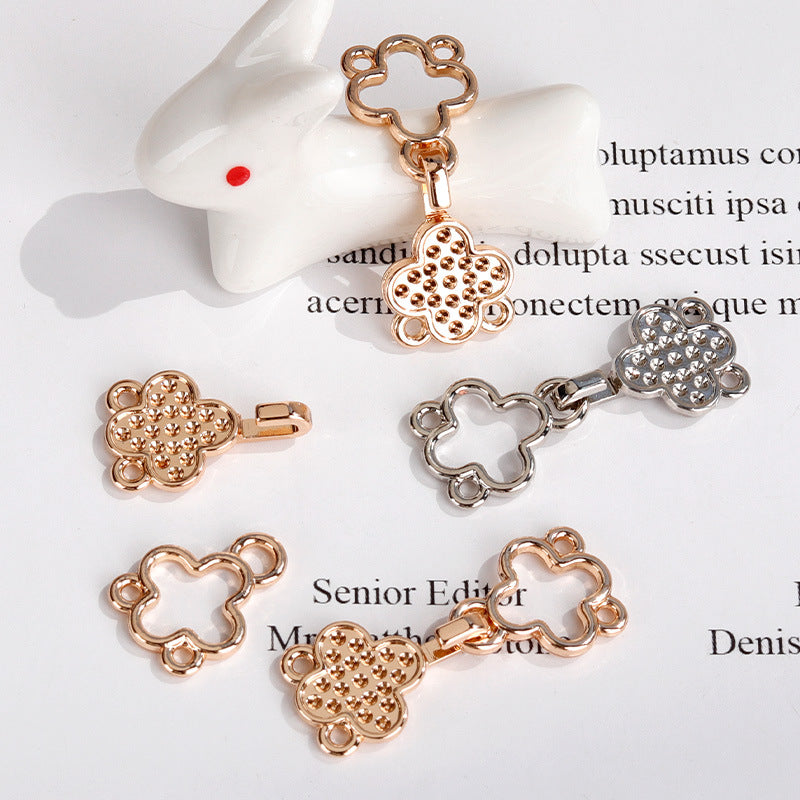 Set of rose gold and silver four-leaf clover hook buttons with crystal details