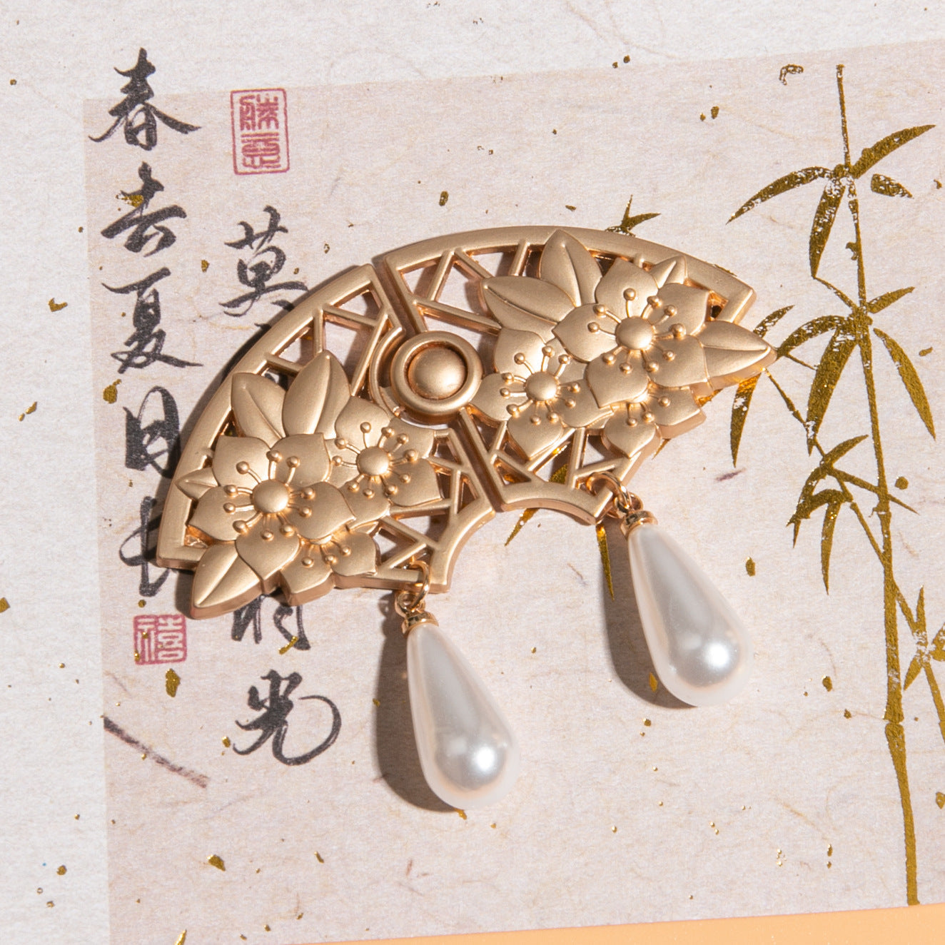 Light Gold fan frog button, lattice petals, star-like blossom clusters, two dangling pearl drops
