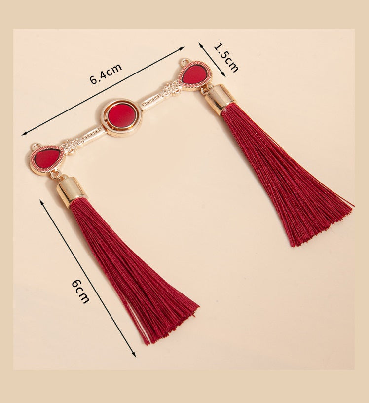 Gold-tone Chinese frog buttons with red tassels; size guide shown